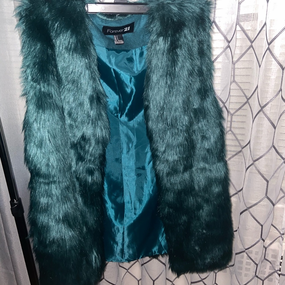 Teal faux fur vest.